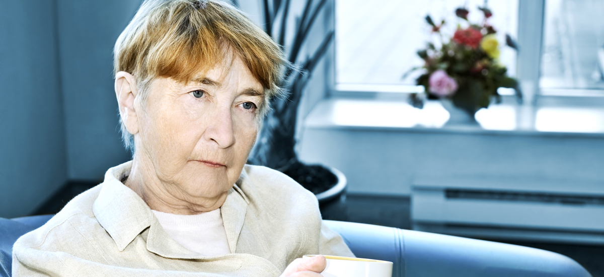Sad elderly woman
